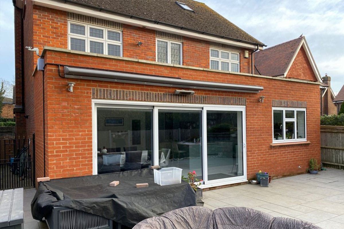 Exterior photo showing brickwork and sliding doors